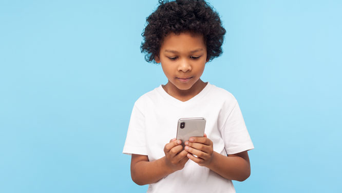 Young child looking at phone